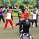 An aerobic instructor leads her exercise group. Monas square is a popular spot for "senam pagi" or morning aerobic.