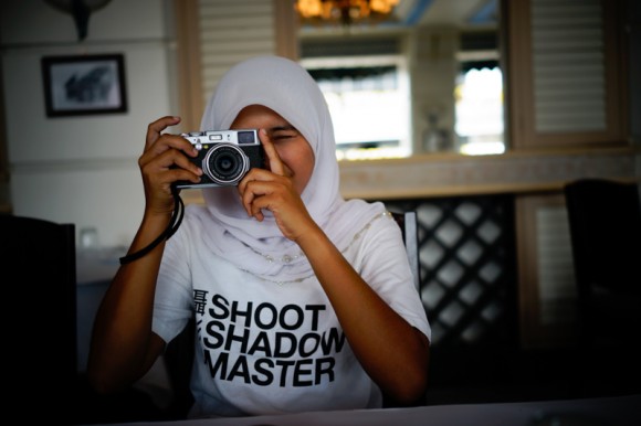 Noor Sofiah trying a Fuji X100 camera.