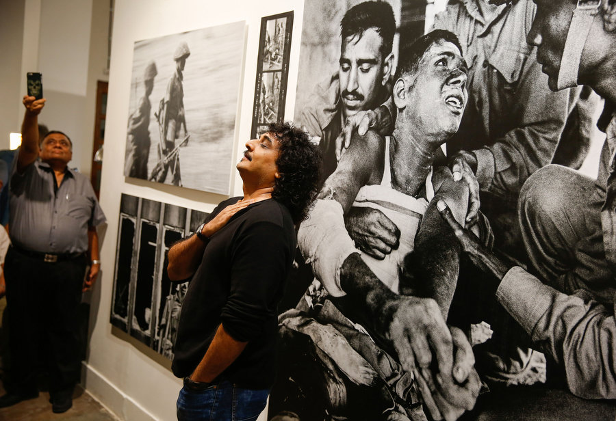 Swapan Parekh, son of the late Kishore Parekh, at his father's exhibition "Bangladesh – A Brutal Birth" at the Delhi Photo Festival 2015. Photograph by Mustafa Quraishi.