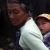 An elderly woman carries a baby in Je Yang camp, where more than 8,000 people have sought shelter from the civil war.